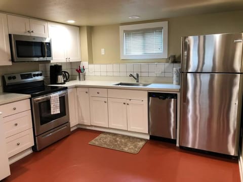 Kitchen or kitchenette, dishwasher, oven, stove