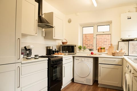 Coffee/tea facilities, microwave, oven, stove, toaster, washing machine, dryer