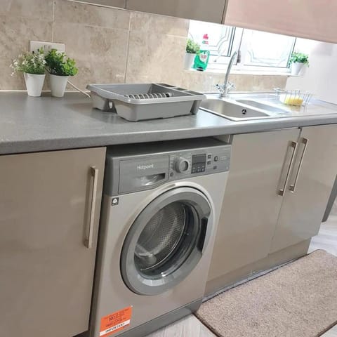 Kitchen or kitchenette, washing machine