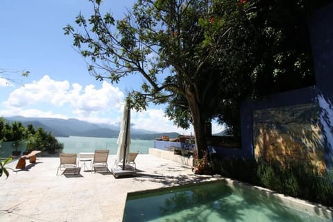 Patio, Natural landscape, Lake view, Mountain view, Pool view, Swimming pool, sunbed