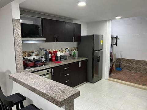 Kitchen or kitchenette, dishwasher, oven, stove