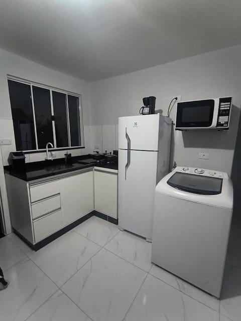 Kitchen or kitchenette, washing machine