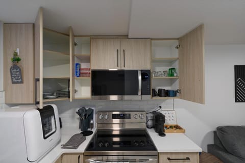 Kitchen or kitchenette, dishwasher, oven, stove, toaster