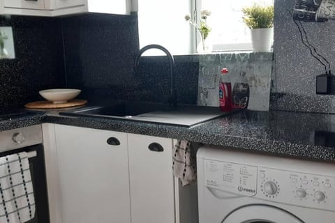 Kitchen or kitchenette, washing machine