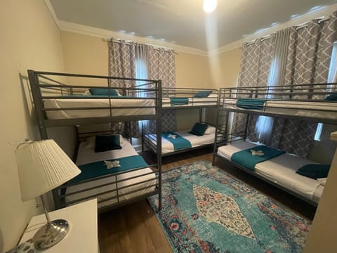 Photo of the whole room, bunk bed, towels