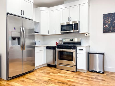 Kitchen or kitchenette, dishwasher, oven, stove