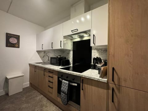 Kitchen or kitchenette, oven, stove, toaster