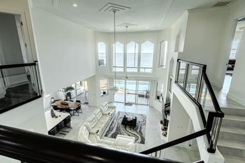 Breathtaking 6BD Riverfront Mansion w Pool House in Cape Coral