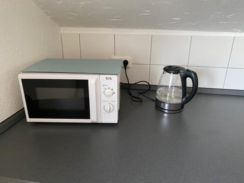 Kitchen or kitchenette, microwave