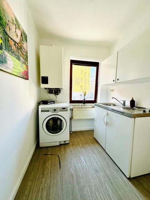 Kitchen or kitchenette, washing machine