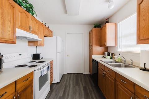 Kitchen or kitchenette, dishwasher, oven, stove