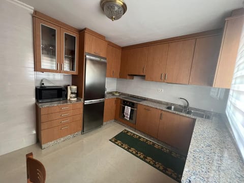 Kitchen or kitchenette, dishwasher, microwave, oven