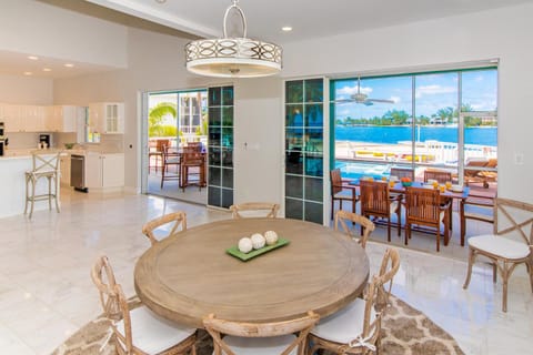 Kitchen or kitchenette, Seating area, Dining area, Pool view