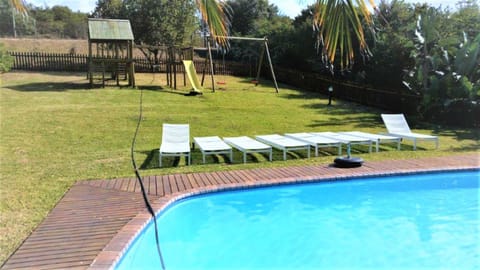 Children play ground, Garden view, Swimming pool, sunbed