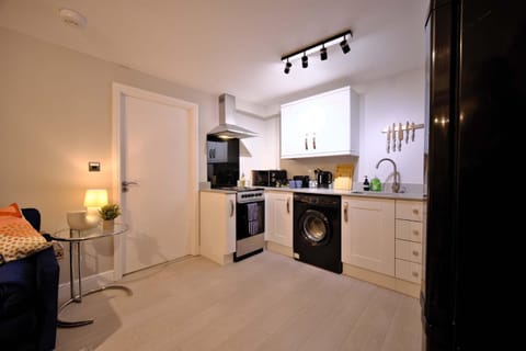 Kitchen or kitchenette, oven, stove, toaster, washing machine