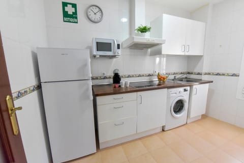 Kitchen or kitchenette, stove, washing machine