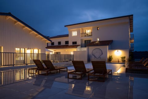 Property building, Patio, Night, Balcony/Terrace, Pool view, Swimming pool, Swimming pool, sunbed