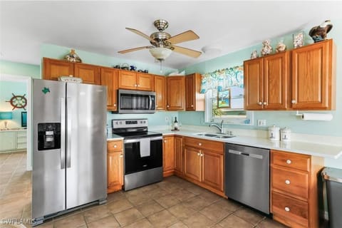 Kitchen or kitchenette, dishwasher, oven, stove