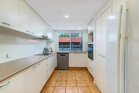 Kitchen or kitchenette, dishwasher, oven, stove