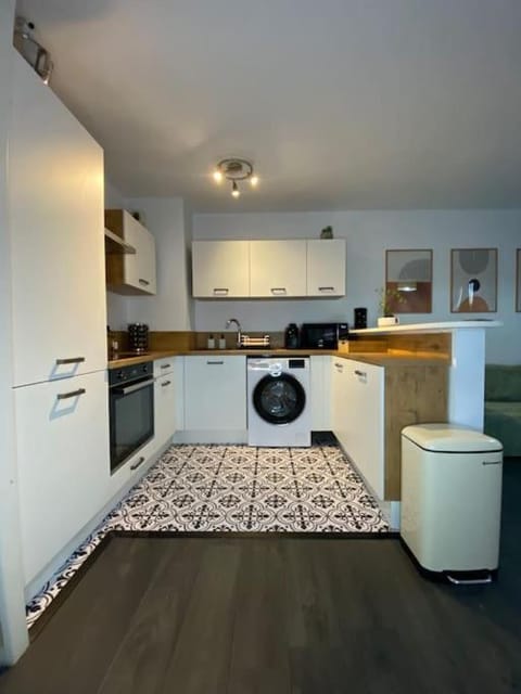 Kitchen or kitchenette, stove, washing machine