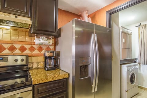 Kitchen or kitchenette, dishwasher, oven, stove