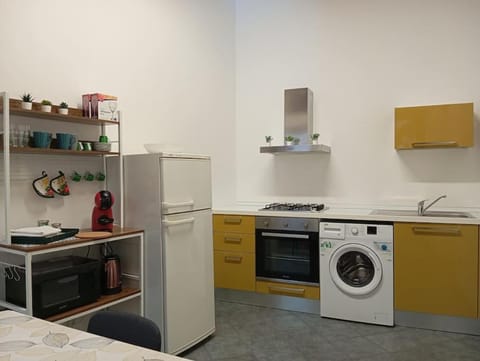 Kitchen or kitchenette, oven, stove, washing machine