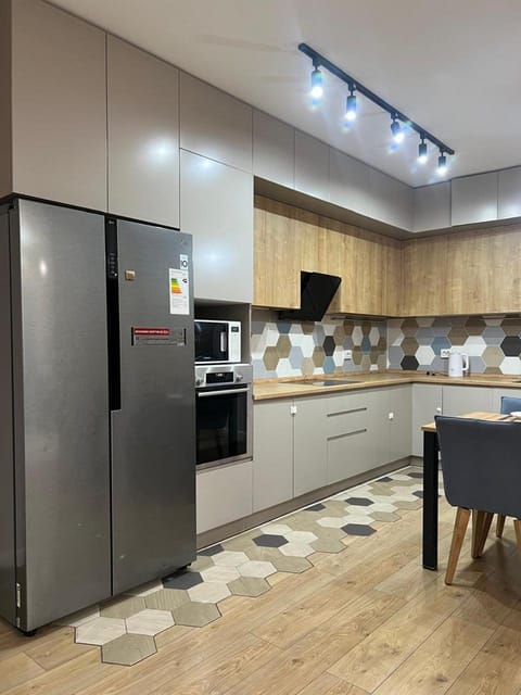 Kitchen or kitchenette, dishwasher, oven, stove