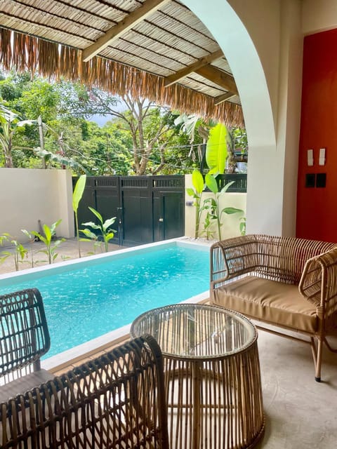 Living room, Seating area, Pool view