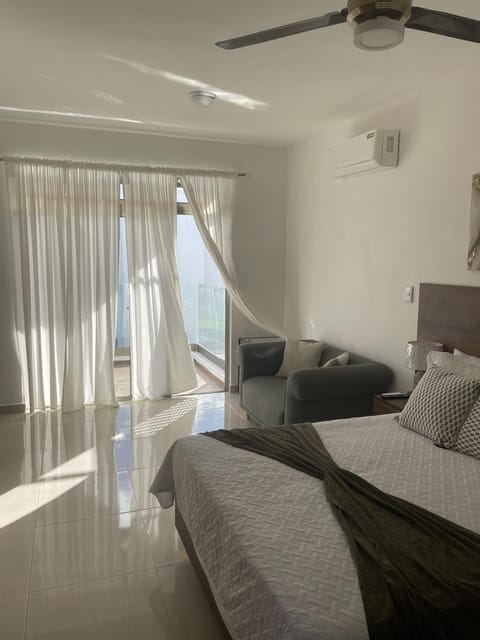 Bed, Living room, Photo of the whole room, Seating area, Bedroom, wardrobe, air conditioner