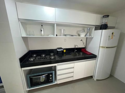 Kitchen or kitchenette, dishwasher, oven, stove