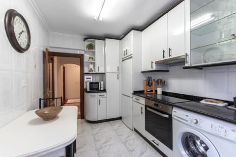 Kitchen or kitchenette, oven, stove, washing machine