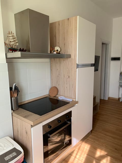 Kitchen or kitchenette, oven, stove