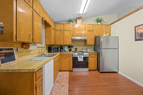 Kitchen or kitchenette, dishwasher, oven, stove