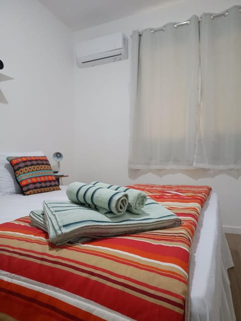 Bed, Photo of the whole room, Bedroom, towels, air conditioner