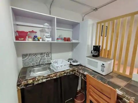 Kitchen or kitchenette, dishwasher, microwave, stove