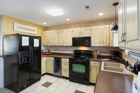 Kitchen or kitchenette, dishwasher, oven, stove