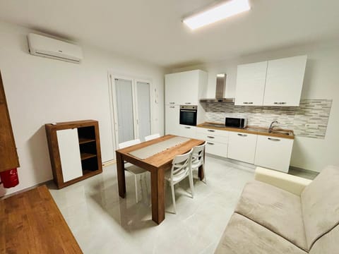 Kitchen or kitchenette, Living room, Dining area, oven, stove, air conditioner