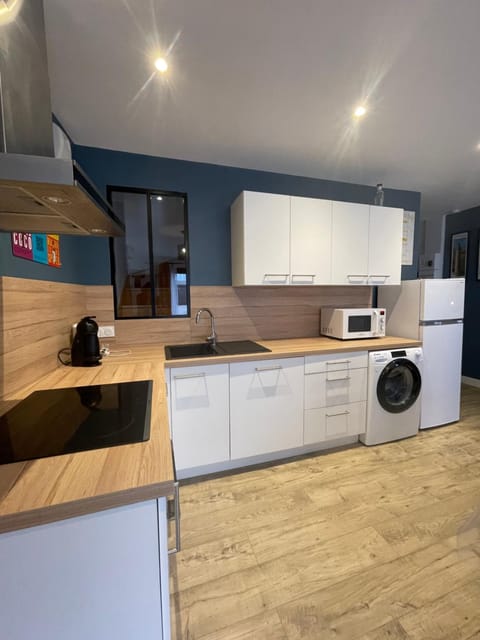 Kitchen or kitchenette, dishwasher, oven, stove, toaster, washing machine