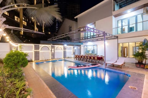 Property building, Patio, Night, Pool view, Swimming pool, Swimming pool, sunbed