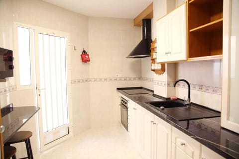 Kitchen or kitchenette, oven, stove