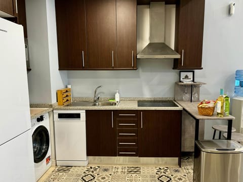 Kitchen or kitchenette, dishwasher, stove, toaster, washing machine