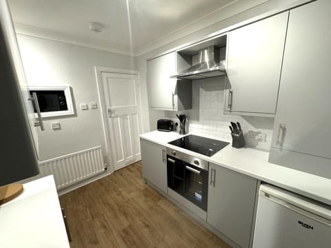 Kitchen or kitchenette, oven, stove