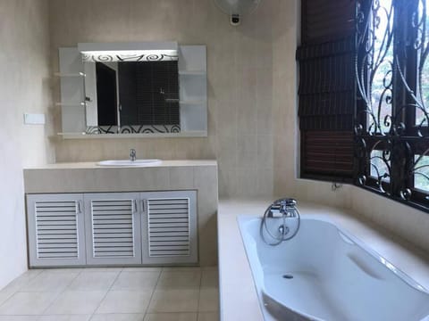 Beachside Bliss 4BR Home with Bathtub, 5-Min Walk to Batu Ferringhi Beach House in Batu Ferringhi, Penang, Malaysia