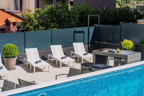 Patio, Seating area, Pool view, sunbed