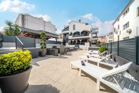 Property building, Patio, Swimming pool, sunbed