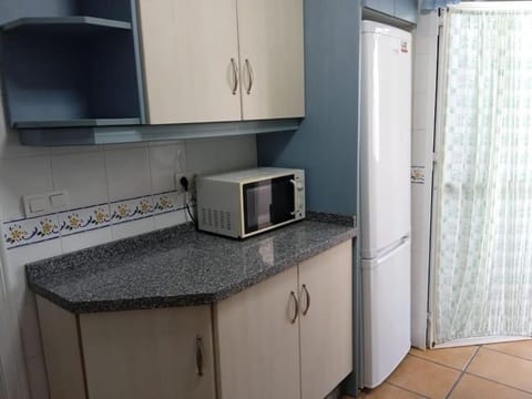 Kitchen or kitchenette, oven, stove, toaster