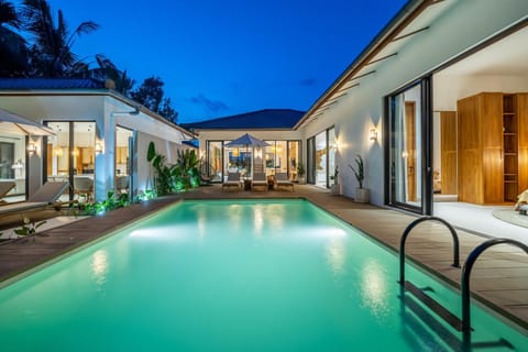 Property building, Patio, Night, Pool view, Swimming pool, Swimming pool, sunbed