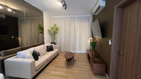 Communal lounge/ TV room, TV and multimedia, Living room, Seating area, air conditioner