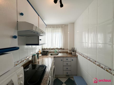 Kitchen or kitchenette, stove, washing machine