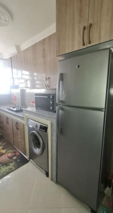 Kitchen or kitchenette, oven, stove, washing machine